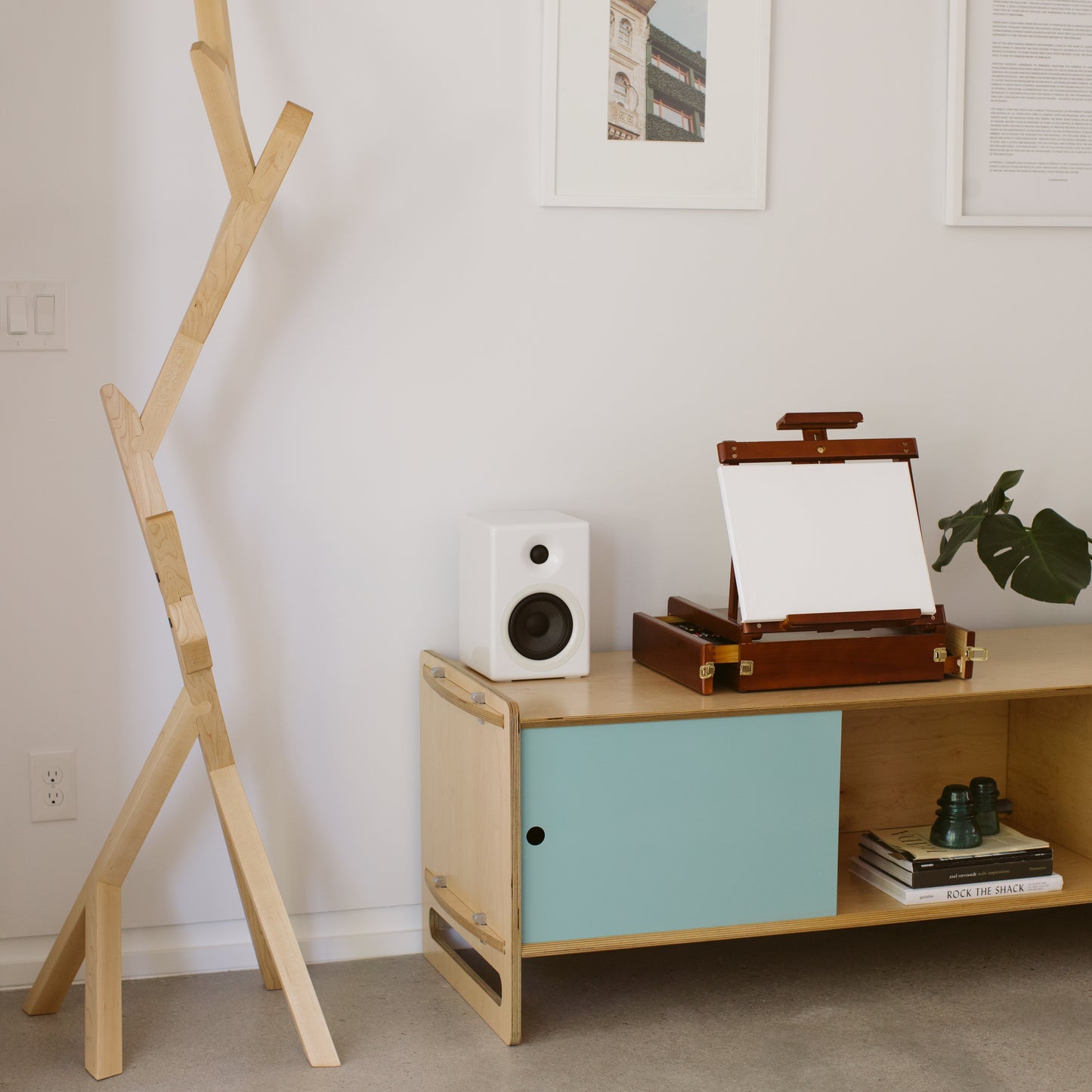 Branched Arbor coat rack next to a low Key AV console